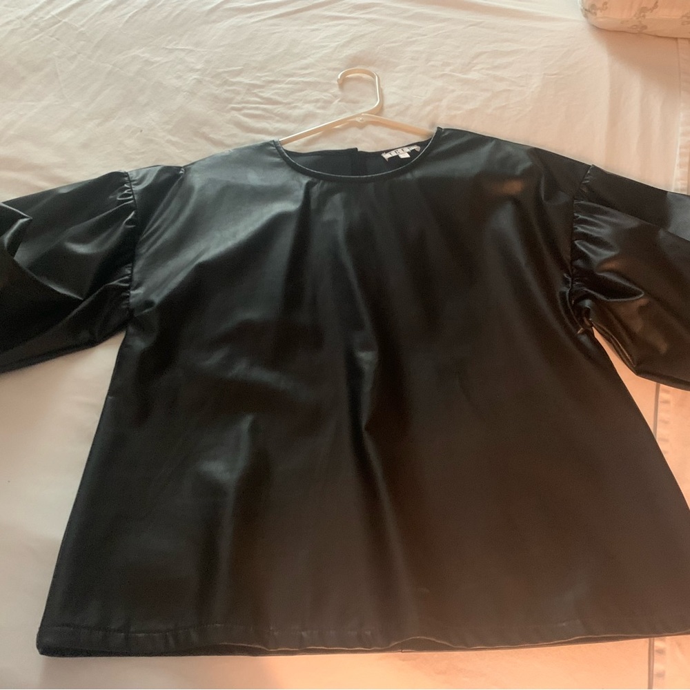 Black puff sleeve faux leather top! Super cute but got it twin for Christmas